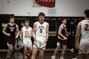 Henry Shoemaker celebrates a shot by Jake Kessner on Feb. 14